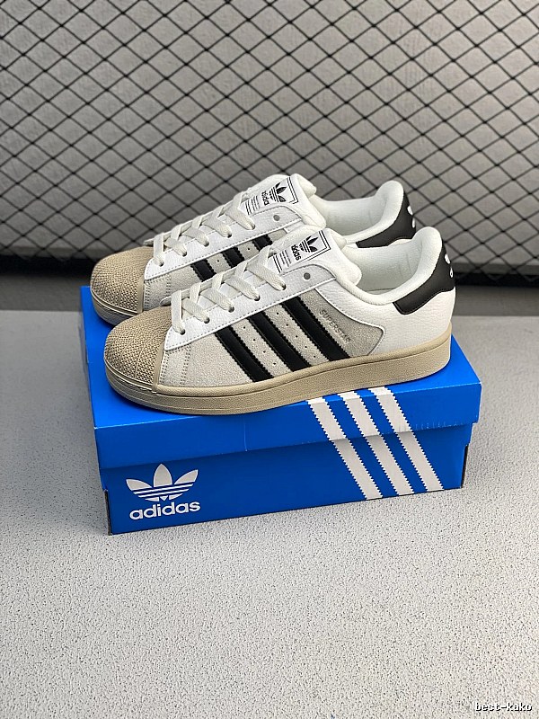 Adidas White and Black Shell-Toe Sneakers and Serrated Side Stripes
